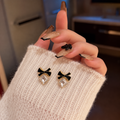 black enamel bow paired with a sparkling square crystal