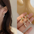bow drop earring featuring sparkling rhinestone stud